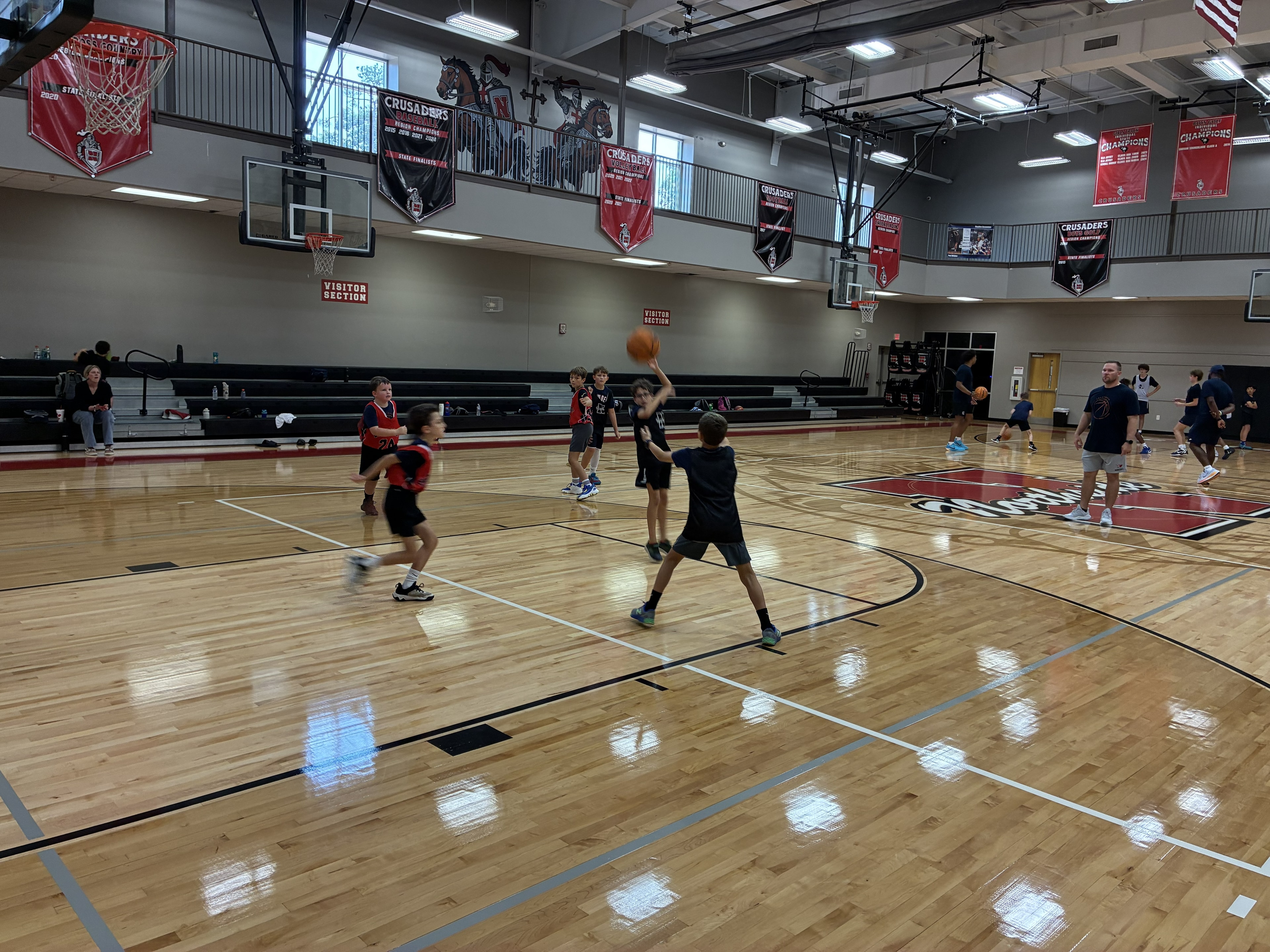 Young athletes practicing basketball on the court