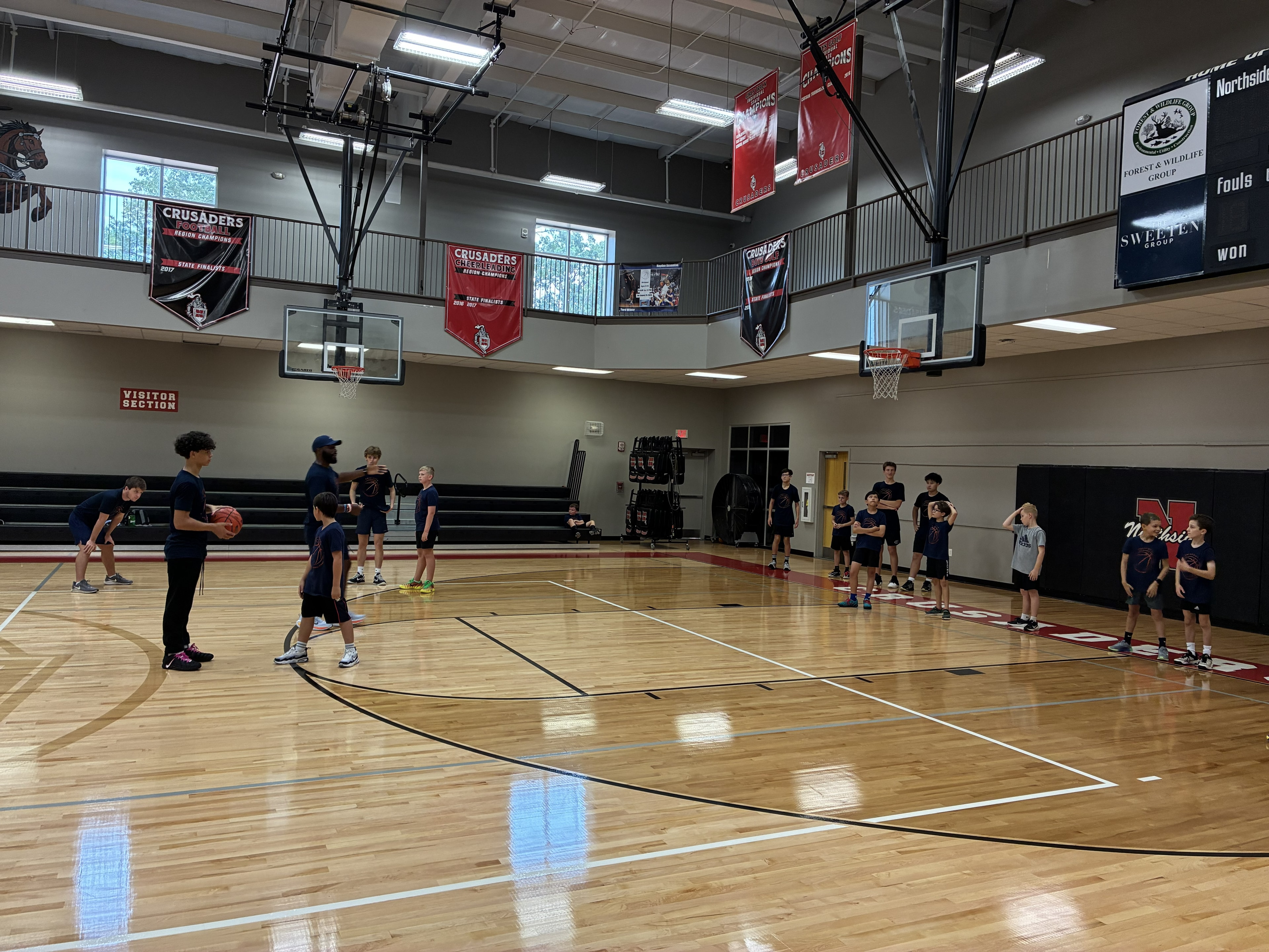 CBA4Youth campers gathered for a basketball drill
