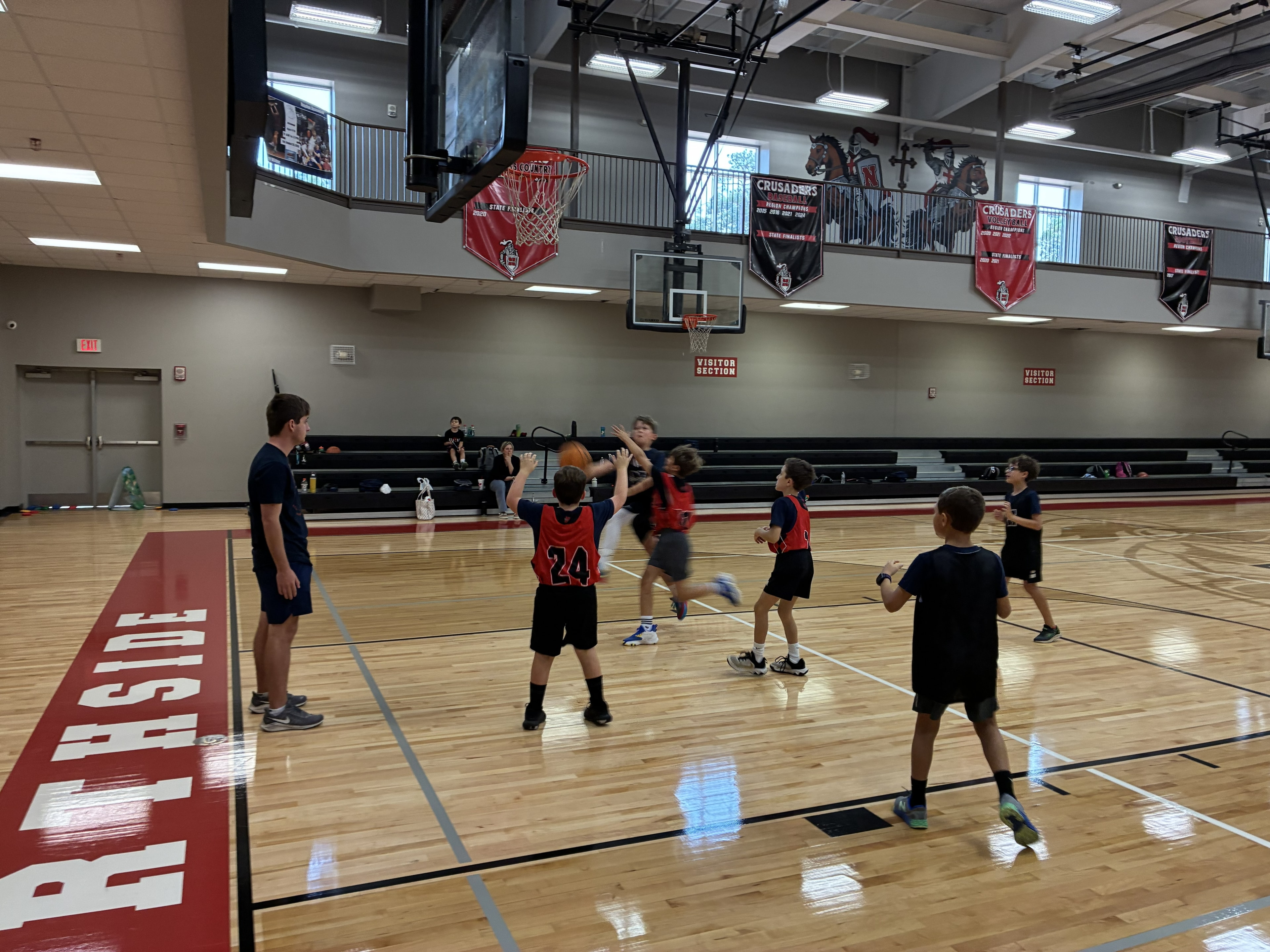 Youth basketball players competing at Northside gymnasium