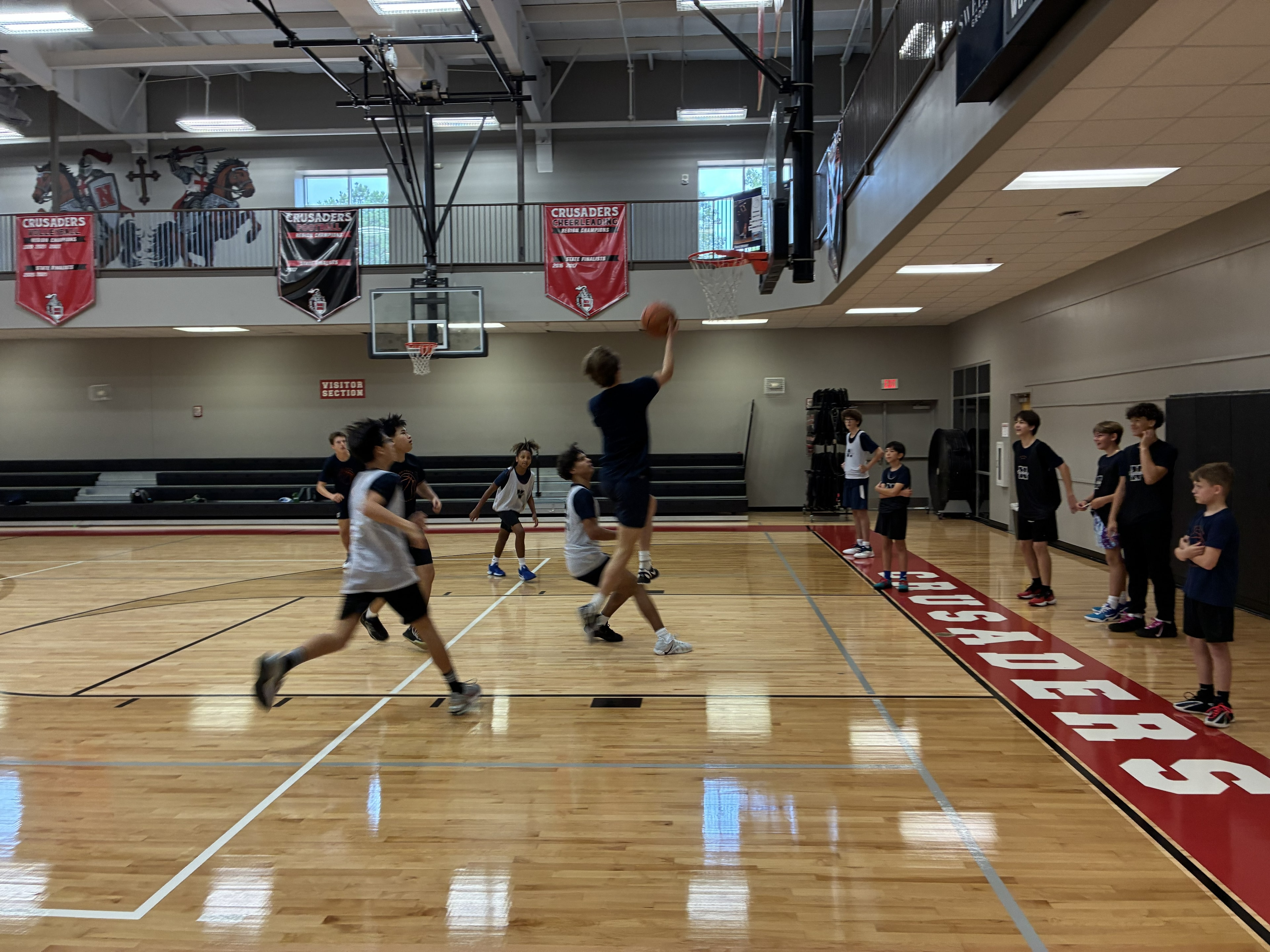 CBA4Youth athletes driving toward the basket