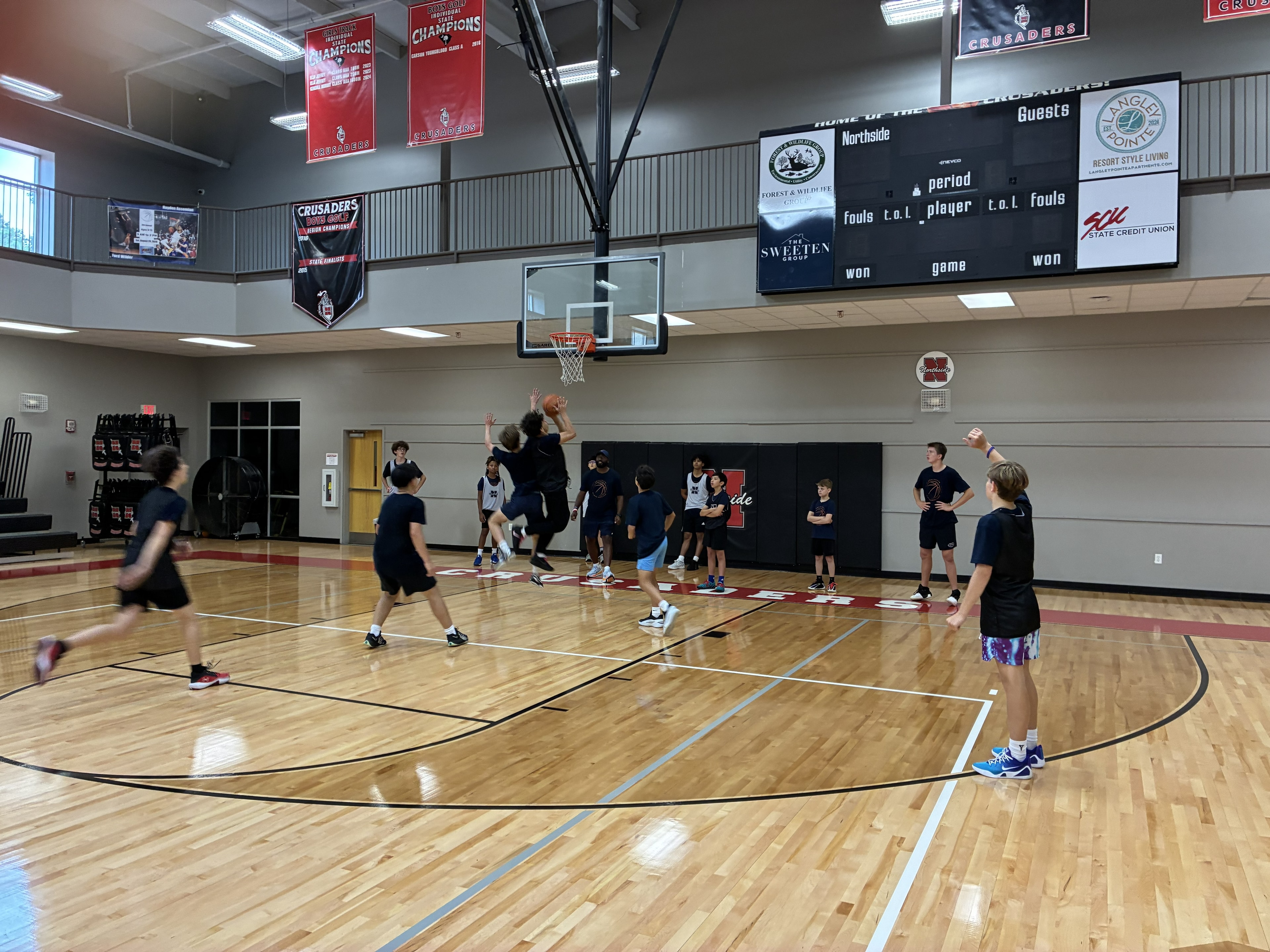 CBA4Youth basketball action beneath the hoop